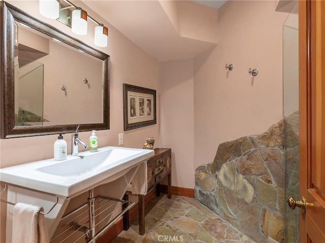 11485 Awenita Ct, Chatsworth, CA 91311 - bathroom with stone finish floors and baseboards