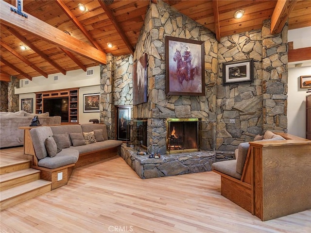 11485 Awenita Ct, Chatsworth, CA 91311 - living area featuring a wooden ceiling with exposed beams, wood finished floors, a fireplace, and high vaulted ceiling