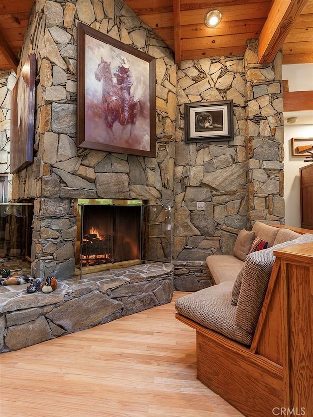 11485 Awenita Ct, Chatsworth, CA 91311 - living area featuring a wooden ceiling with exposed beams, wood finished floors, and a stone fireplace
