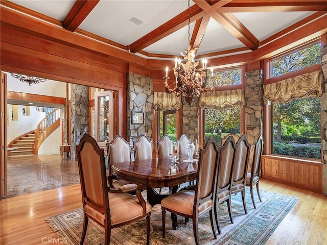 11485 Awenita Ct, Chatsworth, CA 91311 - dining area featuring a chandelier, beam ceiling, stairs, light wood-style flooring, and wood walls