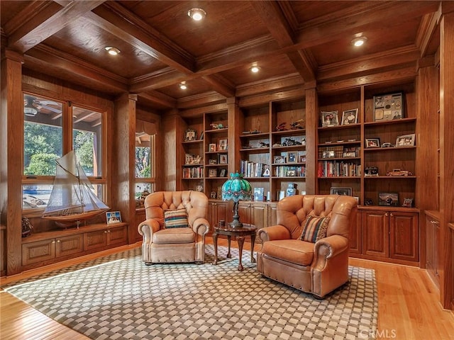 11485 Awenita Ct, Chatsworth, CA 91311 - living area with a wooden ceiling with exposed beams, wood walls, ornamental molding, light wood-style flooring, and built in shelves
