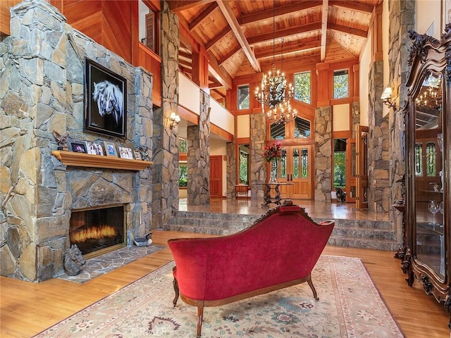11485 Awenita Ct, Chatsworth, CA 91311 - living area with a wooden ceiling with exposed beams, wood finished floors, a chandelier, a fireplace, and high vaulted ceiling
