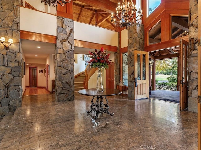 11485 Awenita Ct, Chatsworth, CA 91311 - foyer with high vaulted ceiling, decorative columns, a chandelier, and a wood ceiling with exposed beams