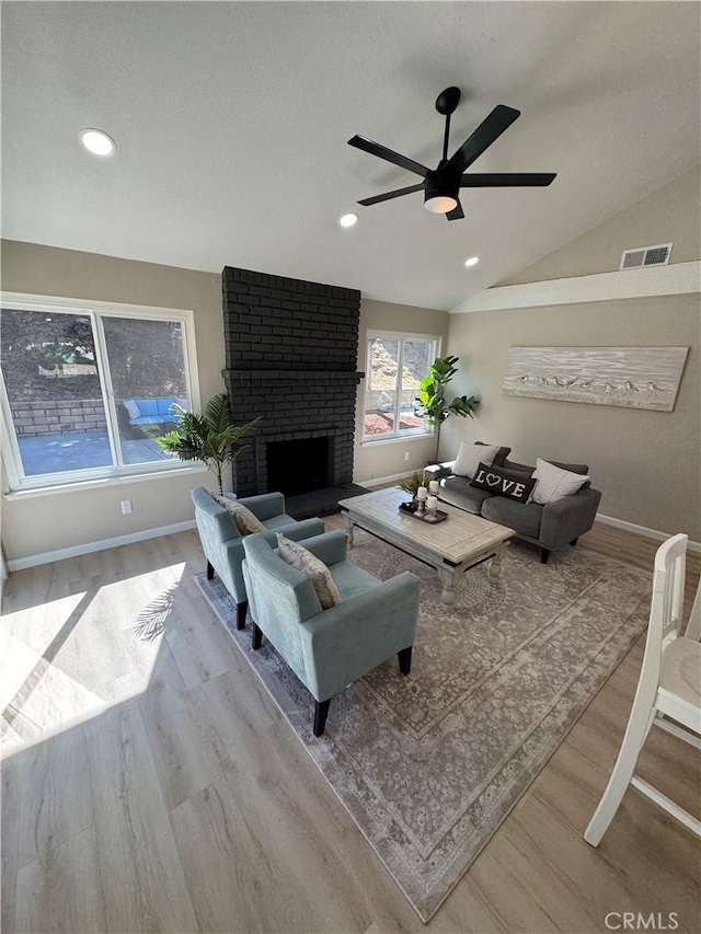 2317 Ravenfall Ave, Rowland Heights, CA 91748 - living area with wood finished floors, a ceiling fan, lofted ceiling, recessed lighting, and a brick fireplace