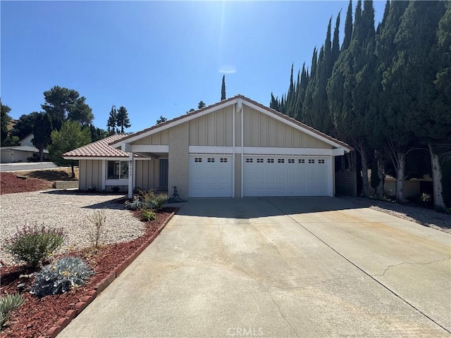 2317 Ravenfall Ave, Rowland Heights, CA 91748 - ranch-style home with concrete driveway, a garage, and board and batten siding