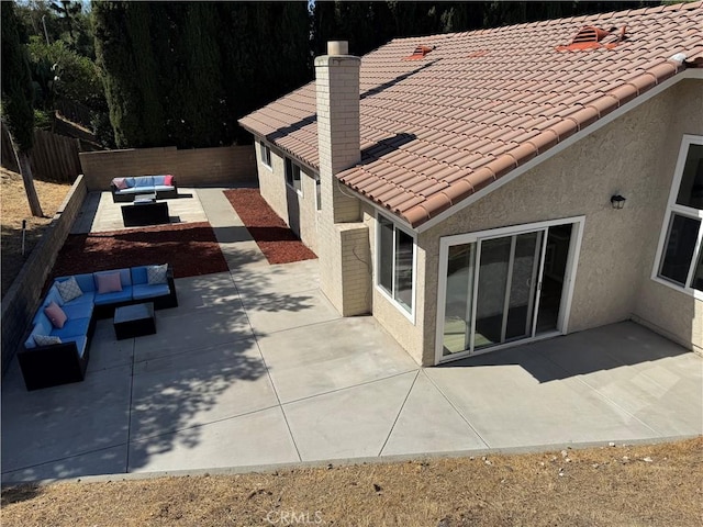 2317 Ravenfall Ave, Rowland Heights, CA 91748 - rear view of property with outdoor lounge area, a patio, stucco siding, a fenced backyard, and a tile roof