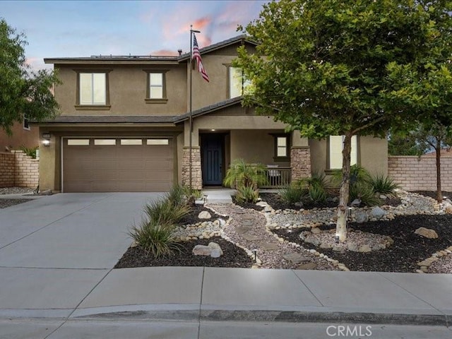 35403 Laurel Tree Ct, Winchester, CA 92596 - view of front of property with covered porch, stucco siding, concrete driveway, and a garage