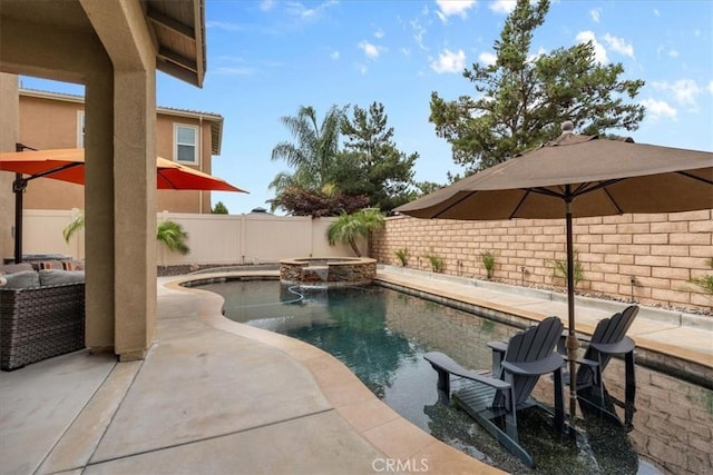 35403 Laurel Tree Ct, Winchester, CA 92596 - view of pool with a fenced backyard, a pool with connected hot tub, and a patio