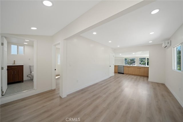 4365 Oneill St, Los Angeles, CA 90032 - unfurnished living room with an AC wall unit, light wood finished floors, and recessed lighting