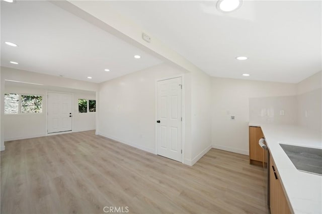 4365 Oneill St, Los Angeles, CA 90032 - kitchen with light wood-style flooring, light countertops, recessed lighting, brown cabinets, and stainless steel dishwasher