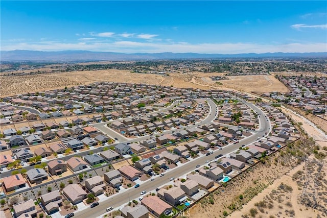 16767 Desert Lily St, Victorville, CA 92394 - aerial perspective of suburban area featuring a mountain backdrop