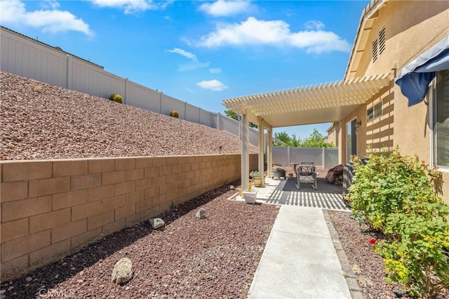 16767 Desert Lily St, Victorville, CA 92394 - fenced backyard featuring a pergola and a patio area
