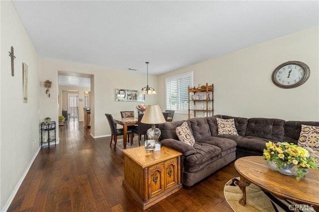 16767 Desert Lily St, Victorville, CA 92394 - living area featuring dark wood finished floors and a chandelier