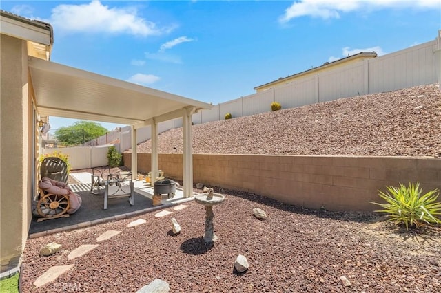 16767 Desert Lily St, Victorville, CA 92394 - fenced backyard with a patio