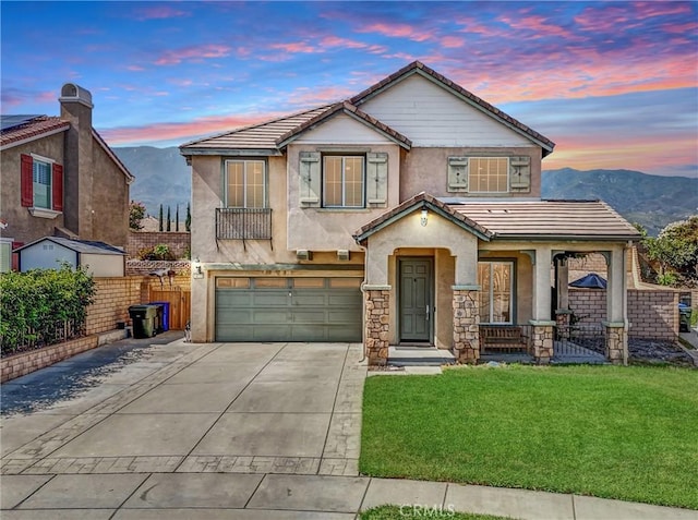 13772 Santa Lucia Ct, Rancho Cucamonga, CA 91739 - view of front facade with a mountain view, an attached garage, concrete driveway, and a tiled roof