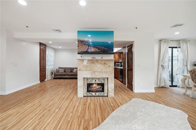301 W Loraine St Unit 3, Glendale, CA 91202 - living room featuring light wood-style flooring, a fireplace, and recessed lighting