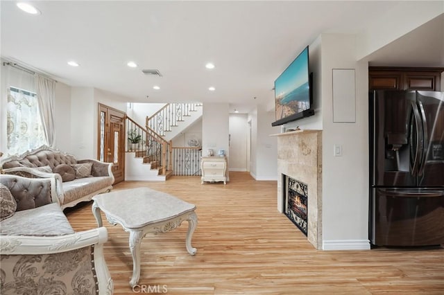 301 W Loraine St Unit 3, Glendale, CA 91202 - living room with light wood-style flooring, stairway, recessed lighting, and a fireplace