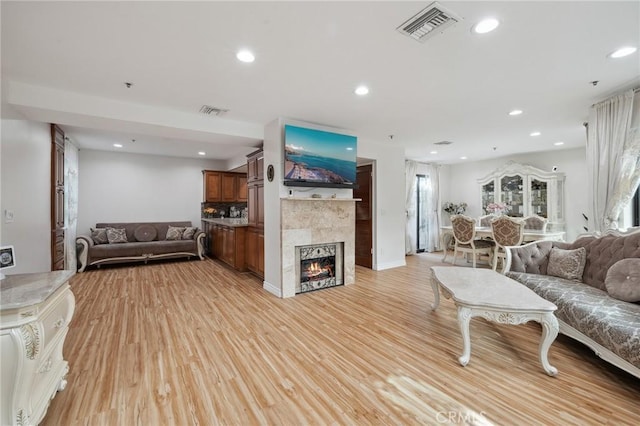 301 W Loraine St Unit 3, Glendale, CA 91202 - living area featuring light wood finished floors, recessed lighting, and a tiled fireplace