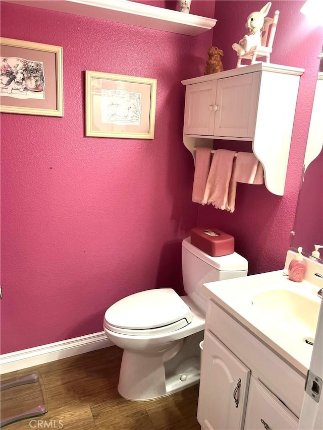 25511 Polaris Ln, Lake Forest, CA 92630 - bathroom with vanity, wood finished floors, and a textured wall