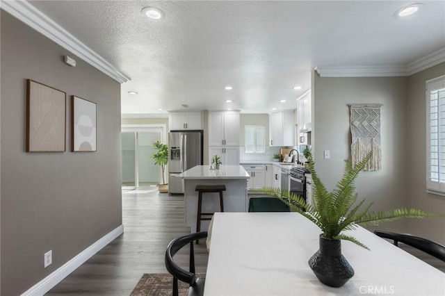2306 255th St, Lomita, CA 90717 - dining space with crown molding, dark wood finished floors, and recessed lighting