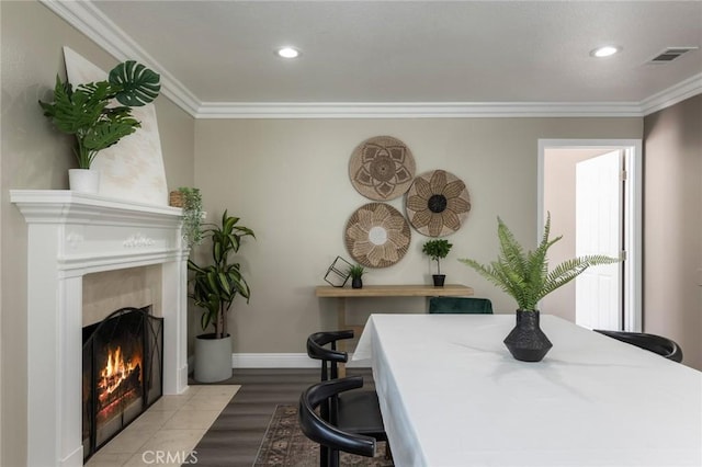 2306 255th St, Lomita, CA 90717 - dining space with a fireplace with flush hearth, wood finished floors, crown molding, and recessed lighting