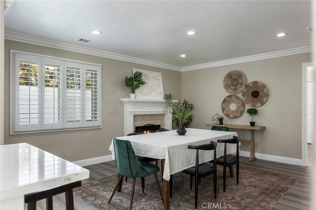 2306 255th St, Lomita, CA 90717 - dining room with wood finished floors, recessed lighting, ornamental molding, and a lit fireplace