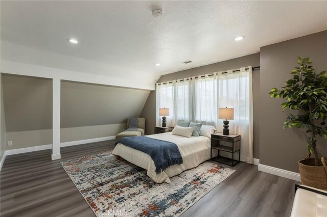 2306 255th St, Lomita, CA 90717 - bedroom with dark wood finished floors, vaulted ceiling, recessed lighting, and a textured ceiling