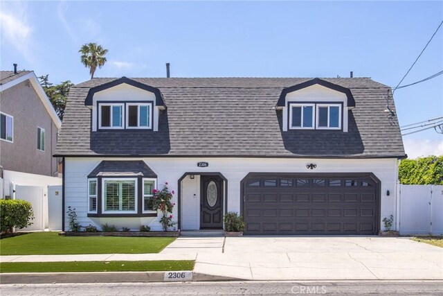 2306 255th St, Lomita, CA 90717 - colonial inspired home featuring a shingled roof, a garage, and driveway