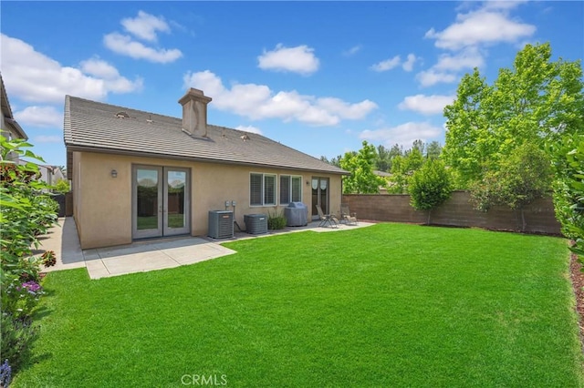 10850 Cameron Ct, Corona, CA 92883 - back of house with a fenced backyard, stucco siding, a patio area, a chimney, and a tiled roof