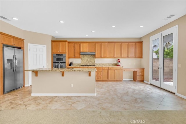 10850 Cameron Ct, Corona, CA 92883 - kitchen with stainless steel appliances, french doors, light stone countertops, light tile patterned floors, and under cabinet range hood