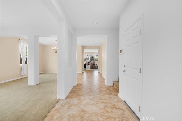 10850 Cameron Ct, Corona, CA 92883 - hallway featuring a chandelier and baseboards