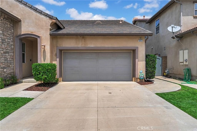 10850 Cameron Ct, Corona, CA 92883 - view of front of house with driveway, a tile roof, a garage, and stucco siding