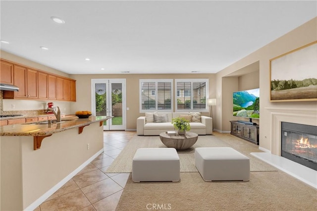 10850 Cameron Ct, Corona, CA 92883 - living area with light tile patterned flooring, a glass covered fireplace, and recessed lighting