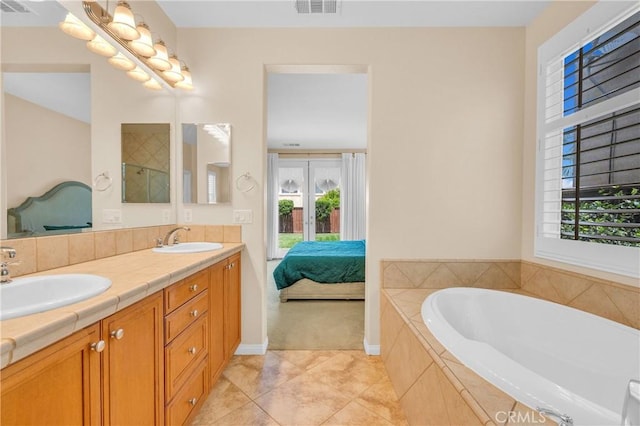 10850 Cameron Ct, Corona, CA 92883 - ensuite bathroom featuring a bath, double vanity, tile patterned floors, and healthy amount of natural light
