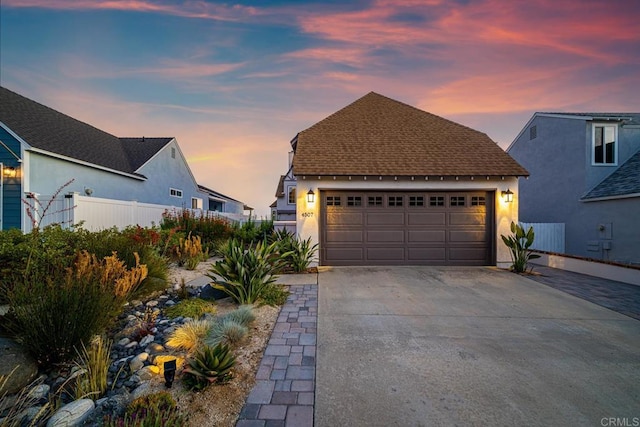 4507 Carnaby Ct, Carlsbad, CA 92010 - view of front facade with a garage, stucco siding, roof with shingles, and concrete driveway