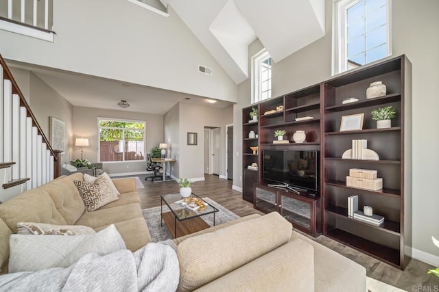 4507 Carnaby Ct, Carlsbad, CA 92010 - living area featuring stairway, wood finished floors, and high vaulted ceiling