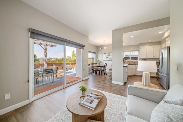 4507 Carnaby Ct, Carlsbad, CA 92010 - living area featuring light wood-type flooring and recessed lighting