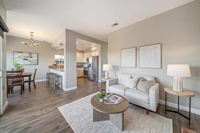 4507 Carnaby Ct, Carlsbad, CA 92010 - living room with a chandelier and dark wood-style floors