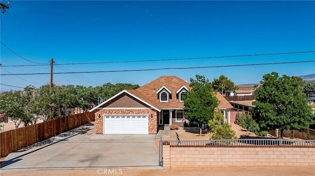 33430 133rd St E, Pearblossom, CA 93553 - traditional home featuring stone siding, driveway, and an attached garage