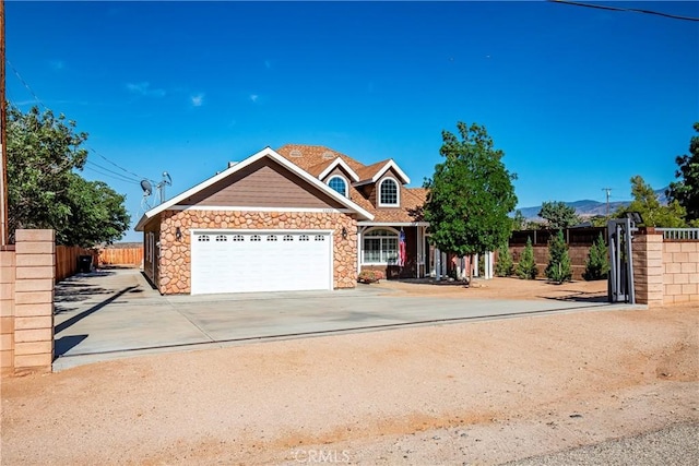33430 133rd St E, Pearblossom, CA 93553 - view of front of home featuring a garage, stone siding, and driveway