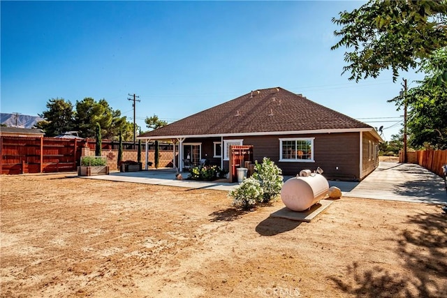 33430 133rd St E, Pearblossom, CA 93553 - rear view of property featuring a patio area and roof with shingles