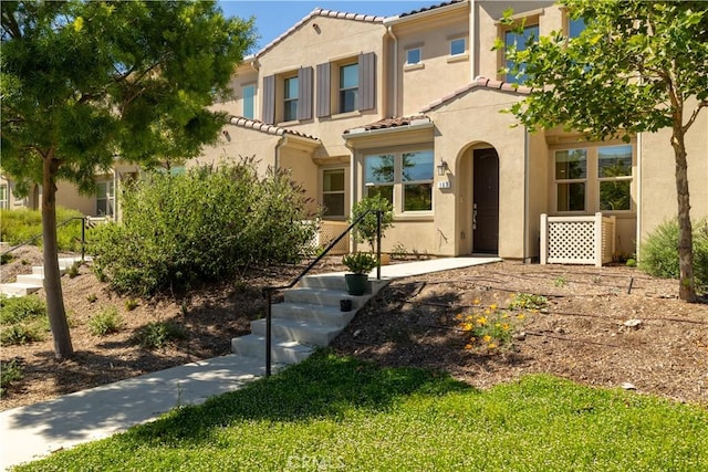 4271 Horvath St Unit 103, Corona, CA 92883 - view of front facade with stucco siding and a tile roof