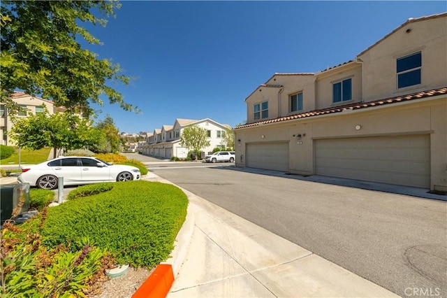 4271 Horvath St Unit 103, Corona, CA 92883 - view of asphalt road with a residential view