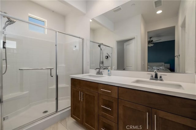 4271 Horvath St Unit 103, Corona, CA 92883 - ensuite bathroom with ceiling fan, a stall shower, double vanity, marble finish floors, and recessed lighting