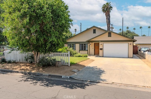 4356 Gardena Dr, Riverside, CA 92506 - view of front facade featuring a garage and driveway