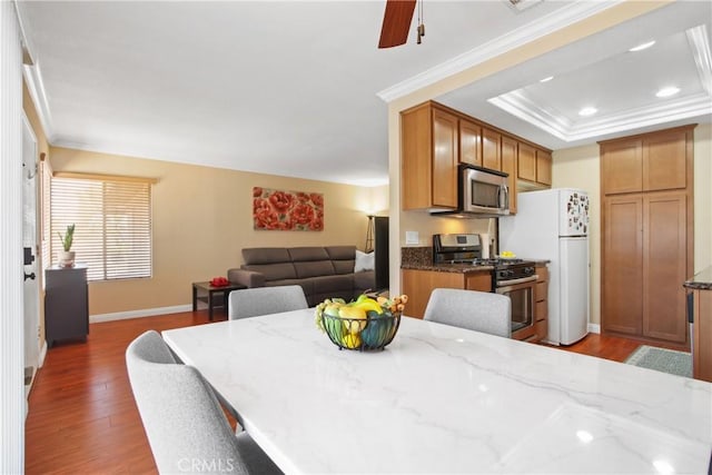 1469 Forest Glen Dr Unit 193, Hacienda Heights, CA 91745 - dining space with dark wood finished floors, crown molding, a tray ceiling, recessed lighting, and a ceiling fan