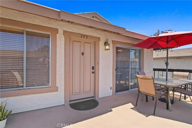 1469 Forest Glen Dr Unit 193, Hacienda Heights, CA 91745 - entrance to property featuring outdoor dining space, a patio, and stucco siding