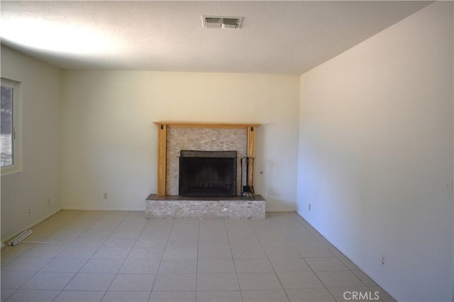 18107 Sycamore St, Hesperia, CA 92345 - unfurnished living room featuring a brick fireplace and light tile patterned floors