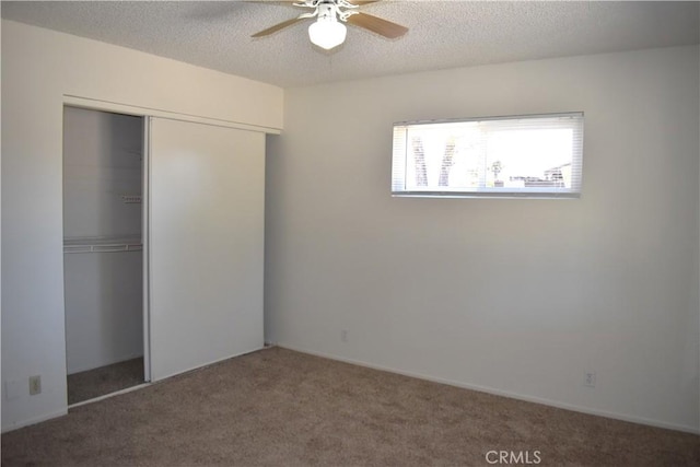 18107 Sycamore St, Hesperia, CA 92345 - unfurnished bedroom with carpet, a closet, a textured ceiling, and ceiling fan