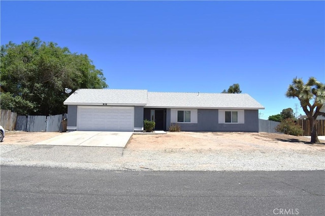 13548 Mount Ranier Way, Hesperia, CA 92345 - ranch-style home featuring a garage, stucco siding, and concrete driveway